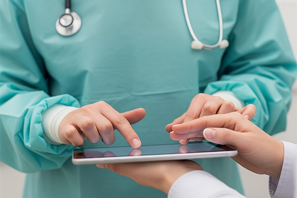 A doctor checking consultation in a tablet