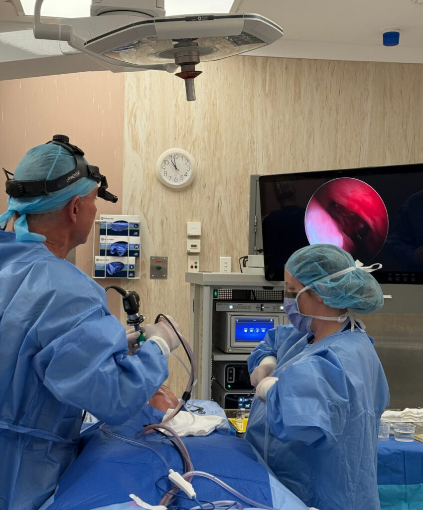Dr Simon Braham Performing FESS Surgery on Patient Cropped